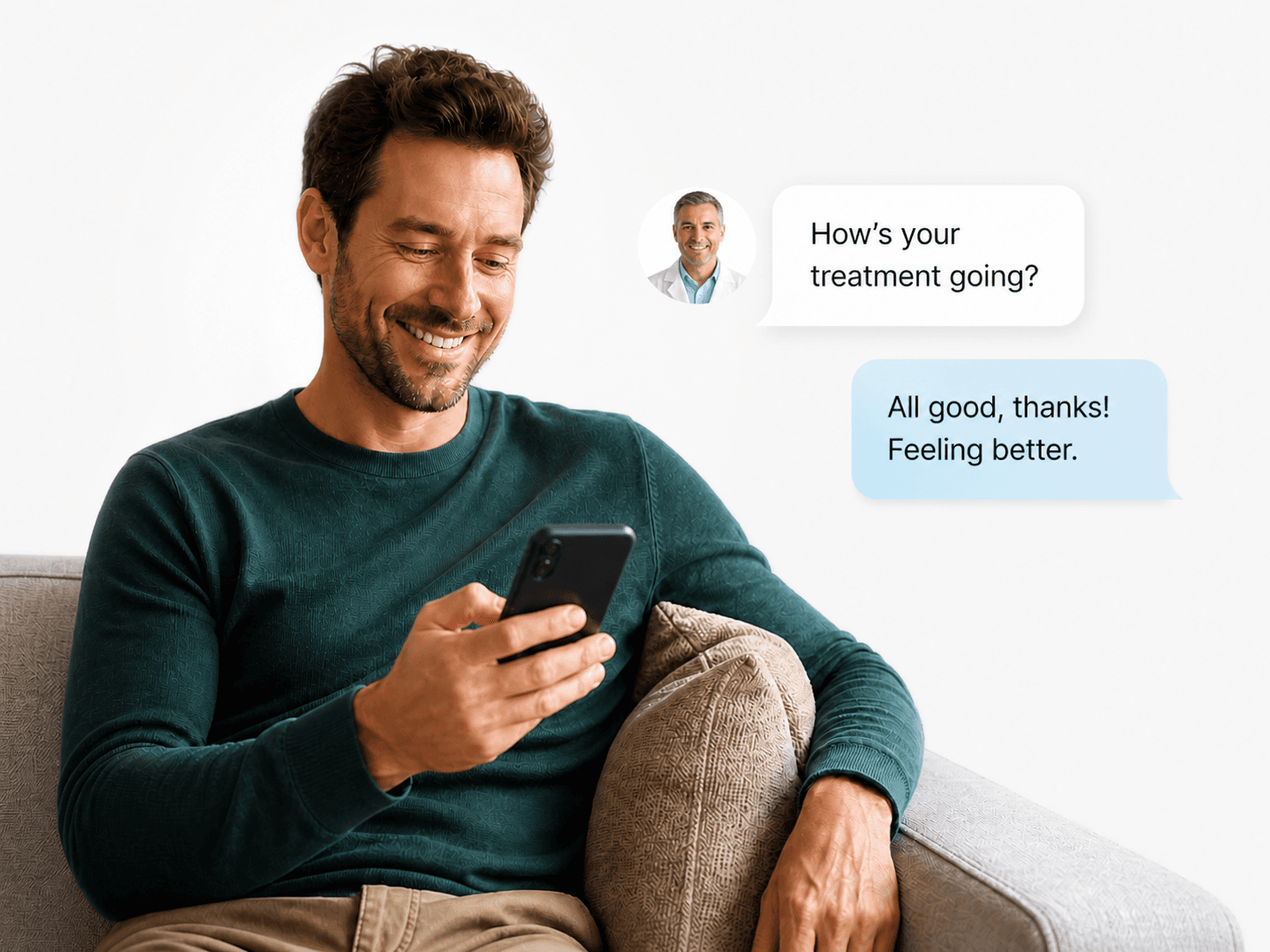 Man relaxing on a couch checking in with his clinician on his phone